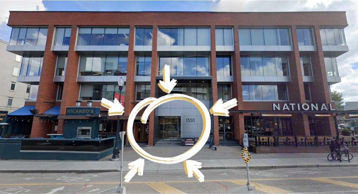 The 1550 building on 5 Street SW, seen from the street. The entrance is in the middle, between Ricardo’s on the left and National on the right, with 1550 beside the glass doors. A gold circle marks it.